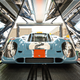 A GT7 race car is inspected on the track.